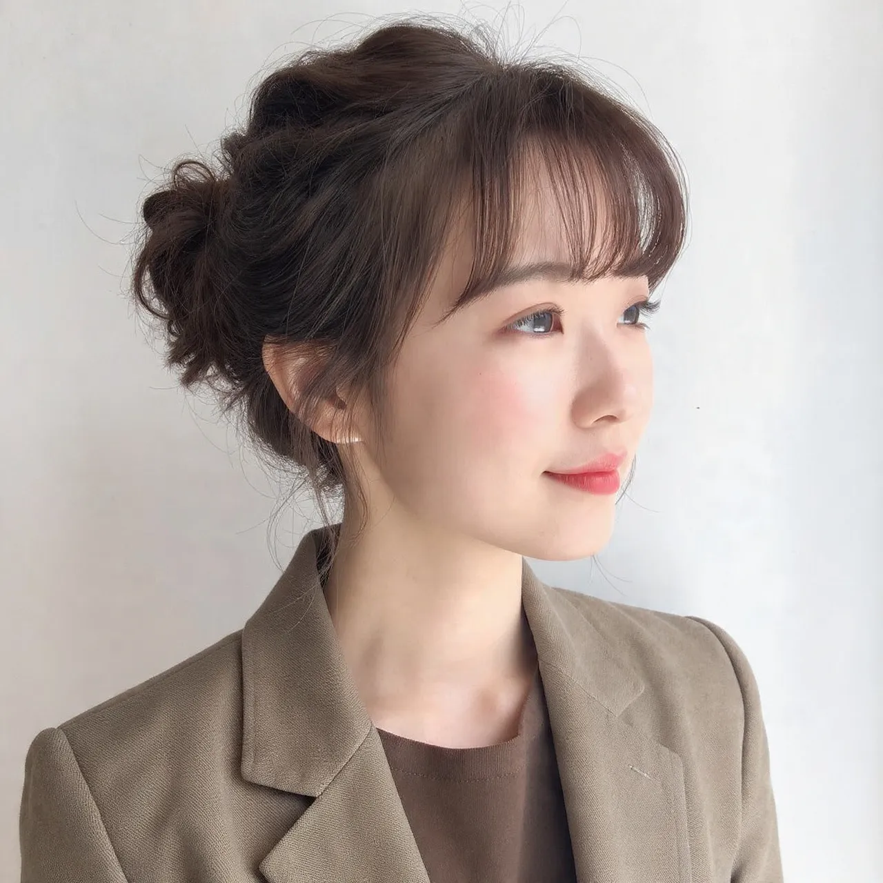 Messy Bun with Soft Curtain Bangs Ideas